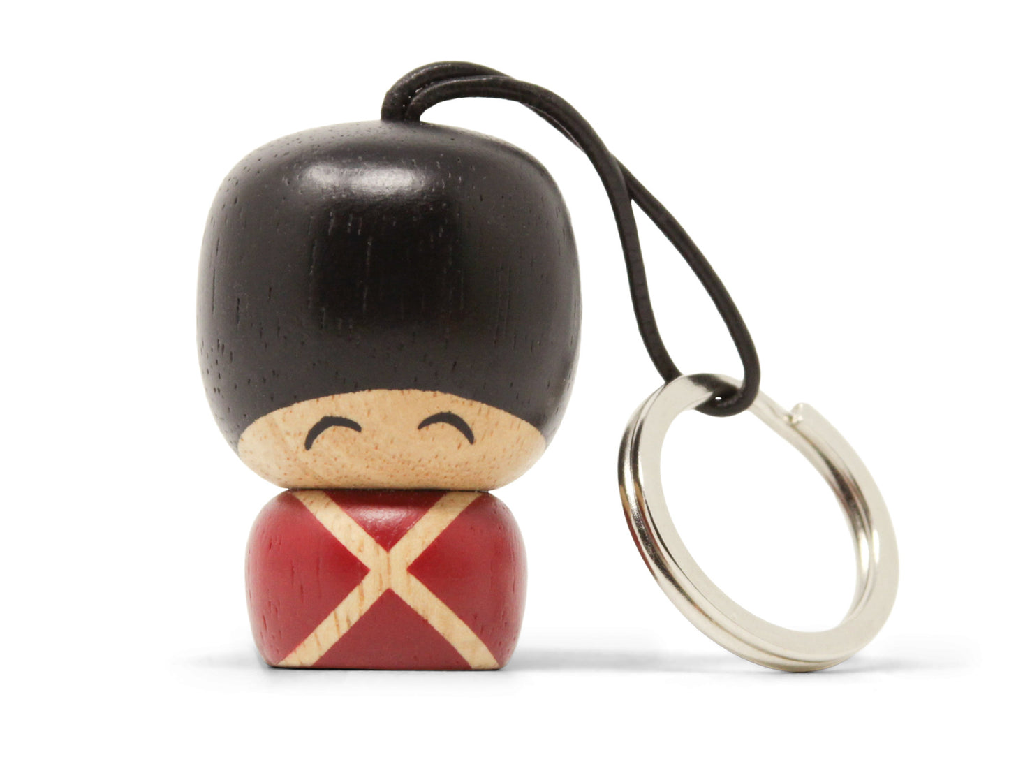 Vincent Gardernøglering. Malet træfigur. Smilende ansigtsudtryk. En fastgjort snor i huen, der holder metalringen nøglerne kan sættes fast i. 