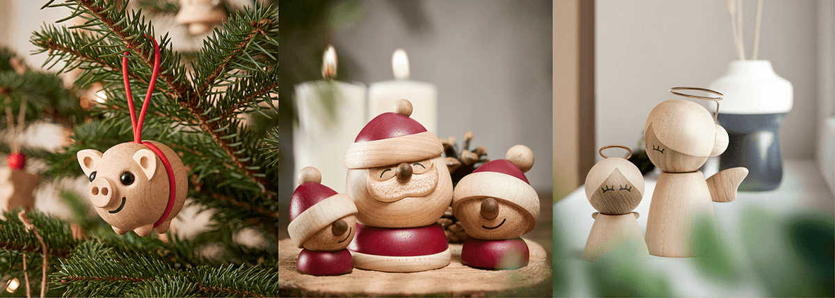 Træfigurer til jul med en gris som juleophæng, en julemand med to nisser og to engle i træ